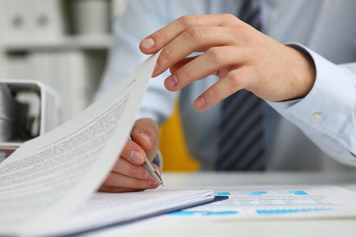 Man going over his credit report with his credit protection lawyer.