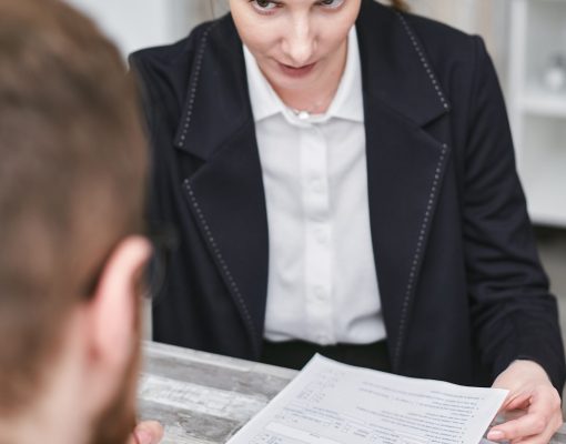 A man about to sign a loan from a predatory lender.